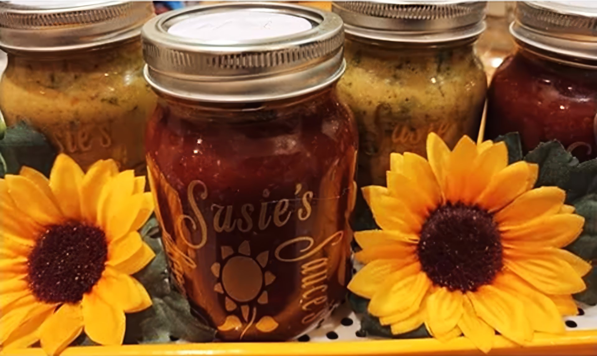 Sassy Susie's sauce jars with sunflowers